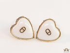 Heart shape white stud earrings with golden alphabets