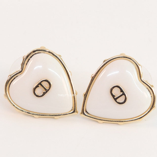 Heart shape white stud earrings with golden alphabets