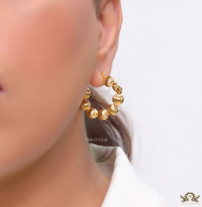 Golden beaded hoop earrings