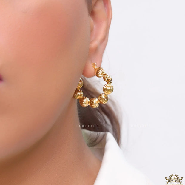 Golden beaded hoop earrings