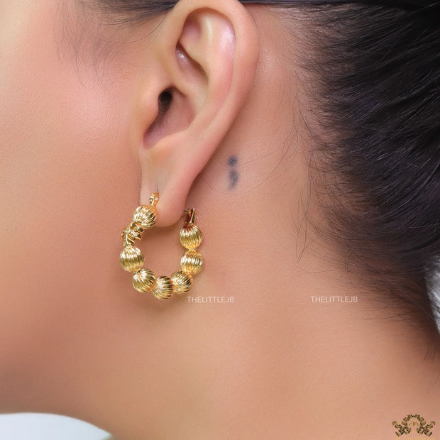 Golden beaded hoop earrings