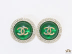 Round green stud earrings with twin C motifs lined with cz