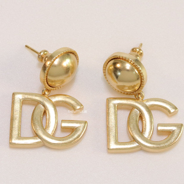 Golden alphabet drop earrings with golden pearl tops