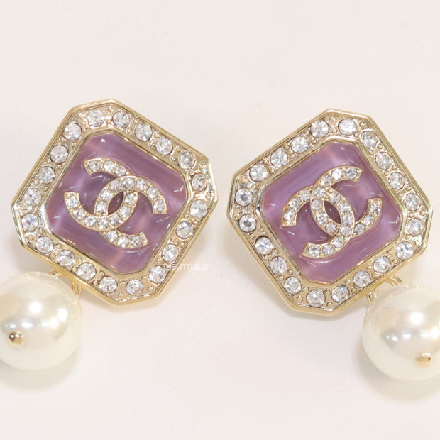 Purple pearl drop earrings with twin C motif in cz