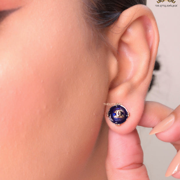 Royal blue studs with double C in centre