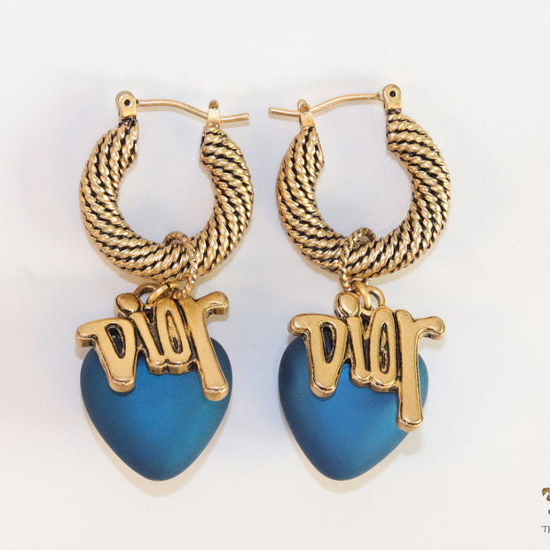 Golden hoops with alphabets and blue pearl drop