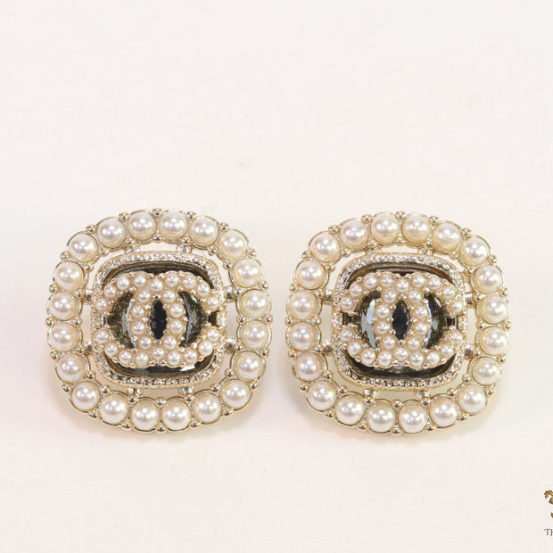 Pearl and cz studs with twin C motif