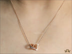 Rose gold plated D initial necklace with interlocking cz ring