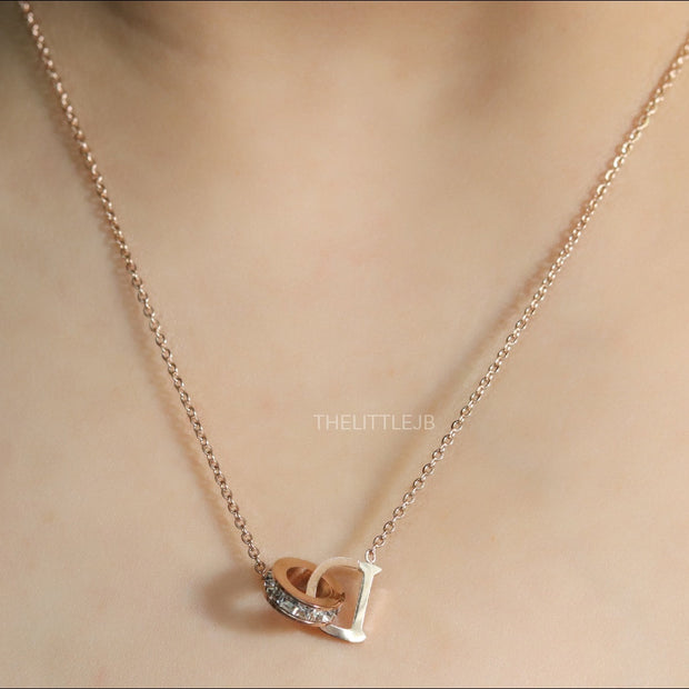 Rose gold plated D initial necklace with interlocking cz ring