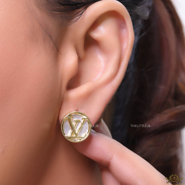 Gold plated alphabet motif studs in golden circular ring
