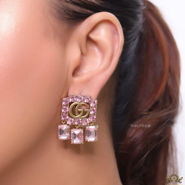 Lavender stone studes with gold plaetd double G motif and lavender stone drop