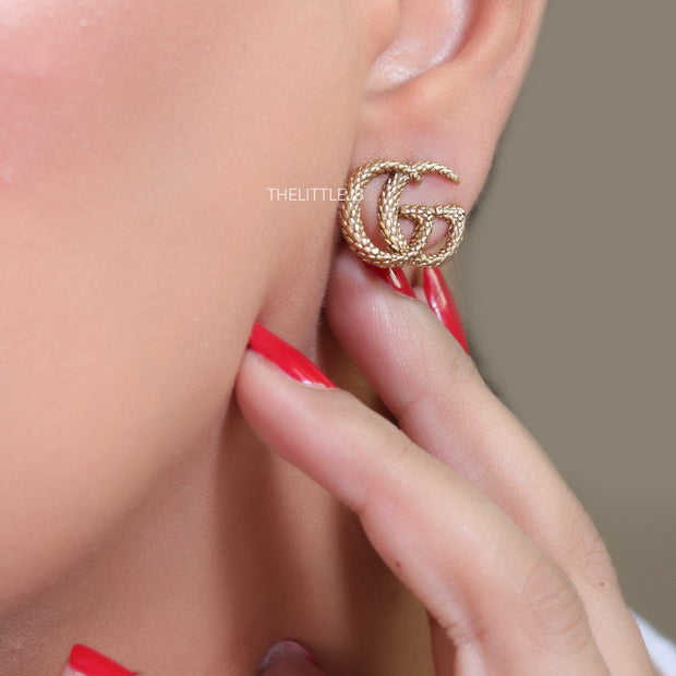 Gold plated earrings with double G initials