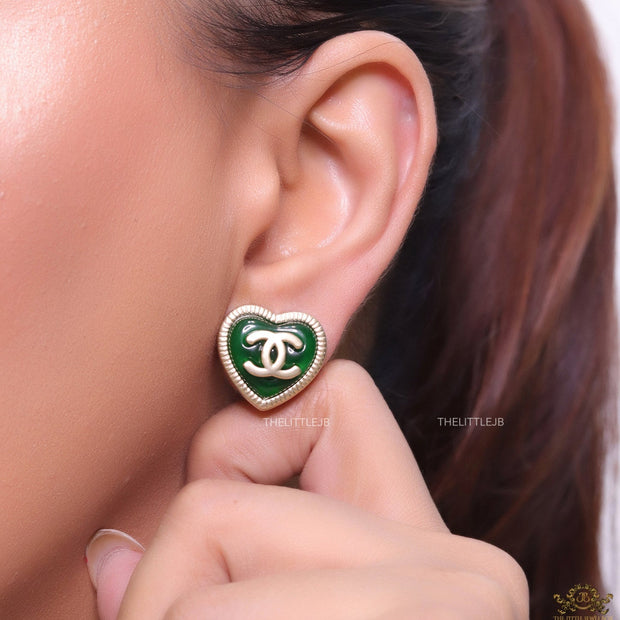 Heart shape twin C motif golden studs with deep green base