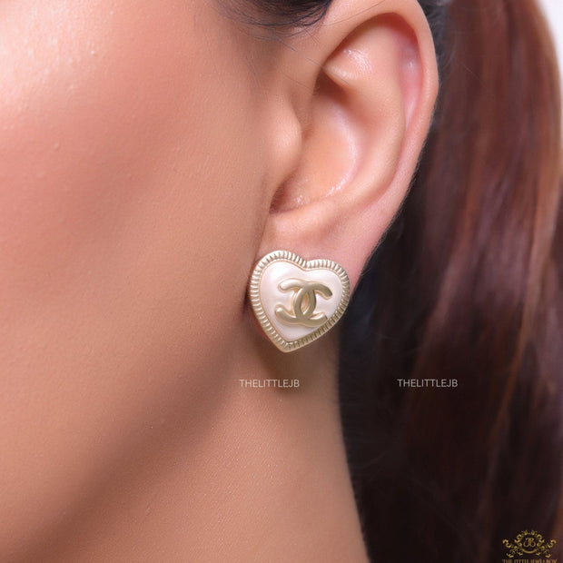 Heart shape twin C motif golden studs with pearl base