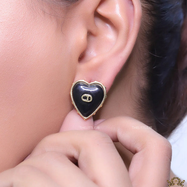 Heart shape black stud earrings with golden alphabets