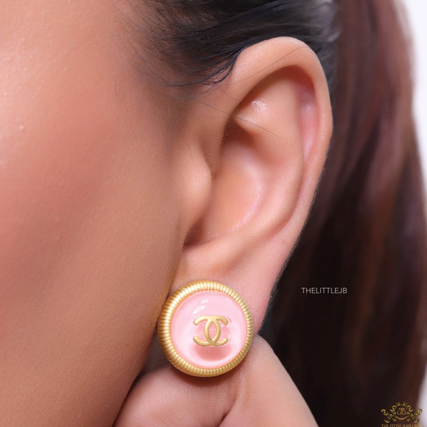 Pink and golden round studs with twin C motif