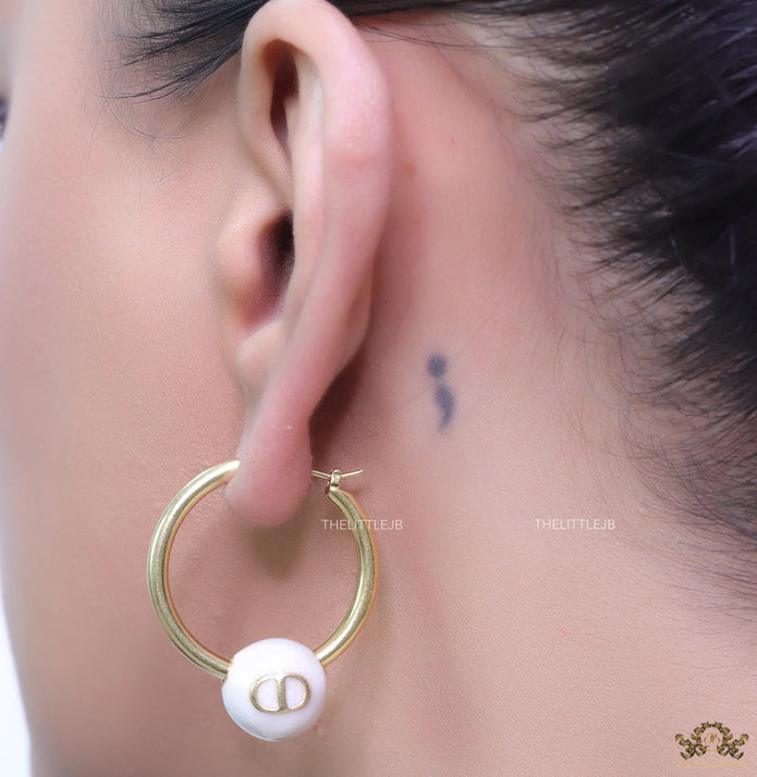 Golden hoops with pearl drops