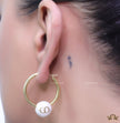 Golden hoops with pearl drops