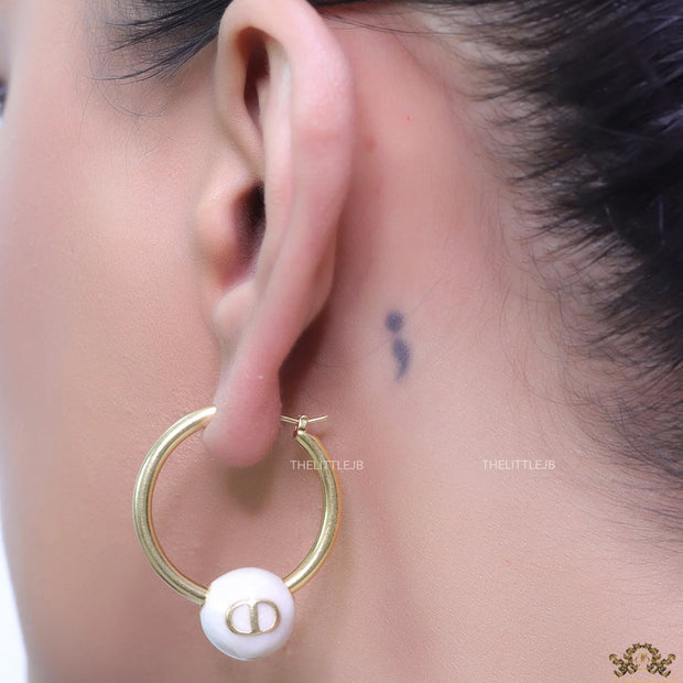 Golden hoops with pearl drops