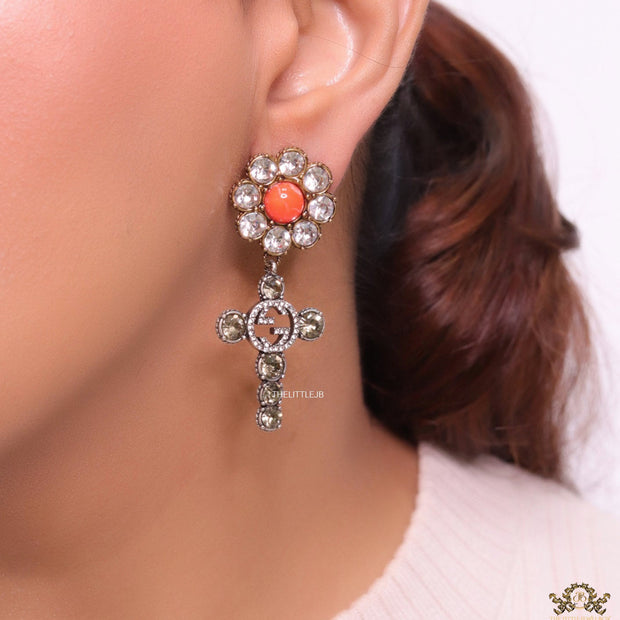Floral cz and alphabet dangles with orange stone centre