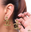Golden button tops with alphabet inscribed twin C drops