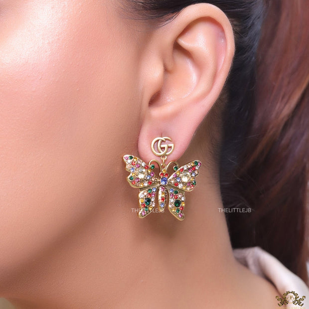 Gold plated twin G motif earrings with multi cz butterfly drops