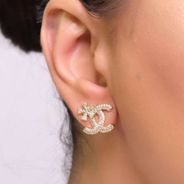 Gold plated flower and twin C motif cz studs