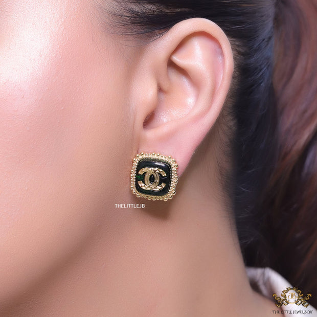 Square deep green and golden stud earrings with golden twin C motifs