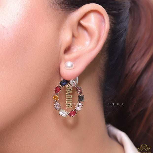 Gold plated pearl bomber earrings with multi cz motif and designer initials