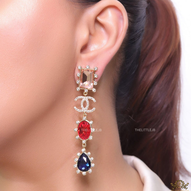 Gold plated cz dangles with red and blue stones and fancy cut cz