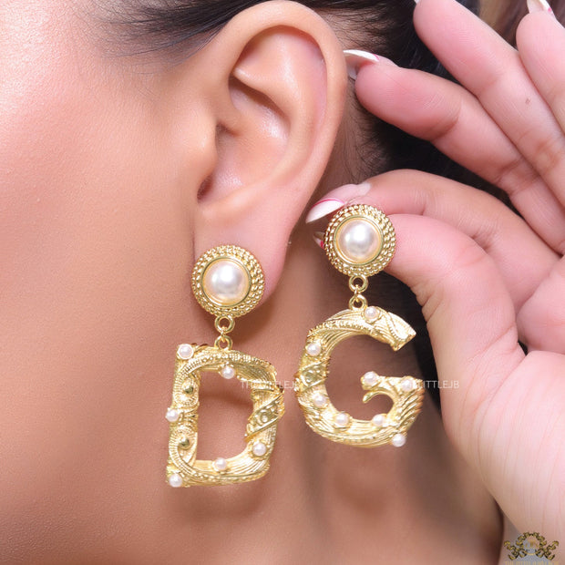 Gold plated alphabet D and G earrings with pearl tops