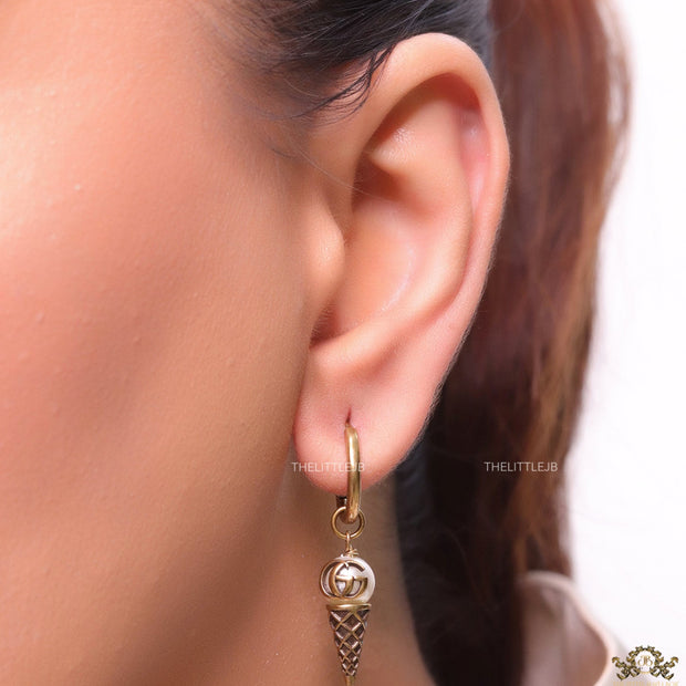Small gold plated hoops with twin G and softy drops