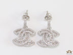 Platinum plated cz dangle earrings with twin C motif