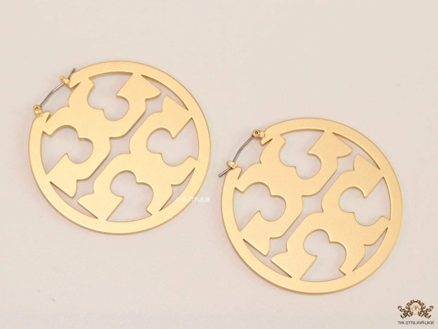 Matt Gold hoops with T motifs