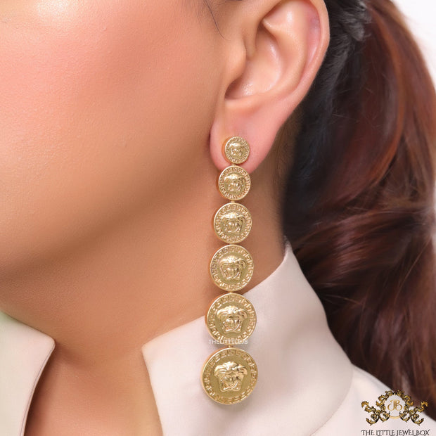 Gold plated embossed Medusa motif on golden circular base with golden details long chain studs
