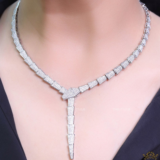 Platinum plated snake look knot necklace in cz