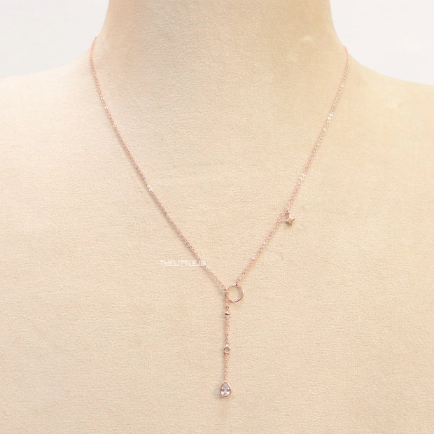 rose gold knot necklace with cz drop and small charms