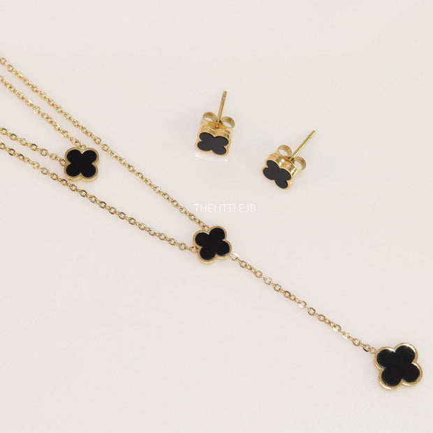 Dual chain necklace with black onyx clovers in gold finish