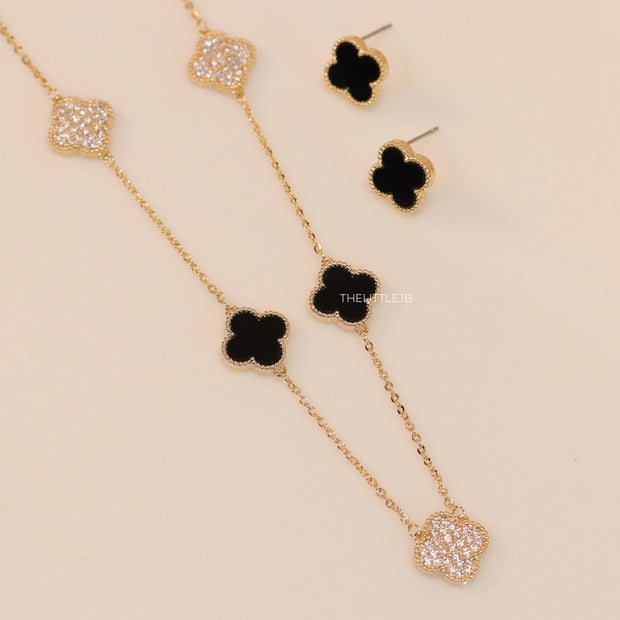 Gold plated necklace set with cz and black enamel coated clovers