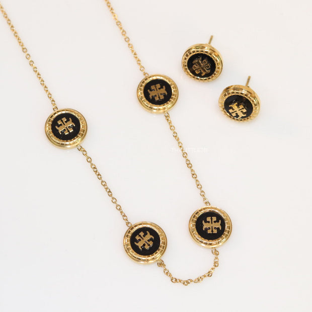 Gold plated necklace set with T motif black enamel coated discs