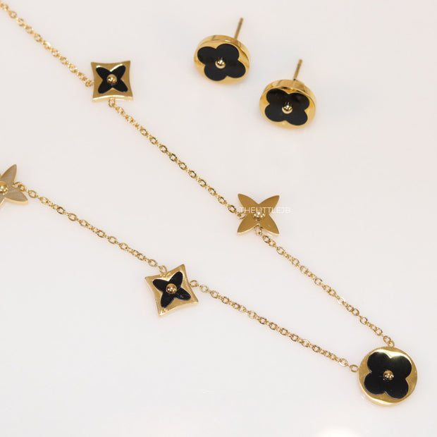 Clover necklace set in black enamel and gold plating