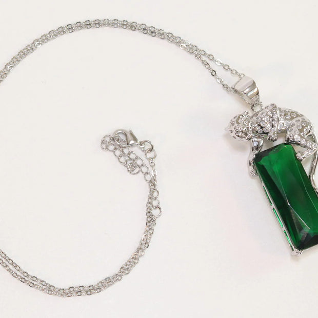 Platinum plated leopard on green stone pendant necklace with cz