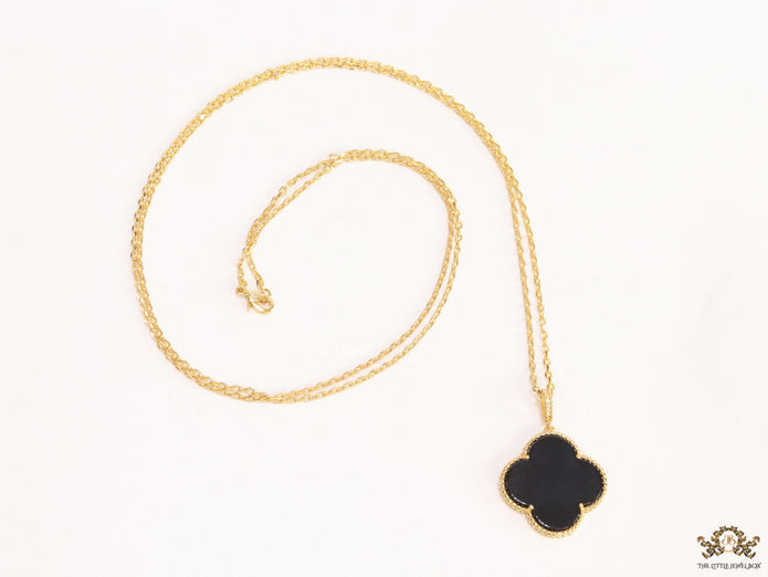 Black enamel clover pendant in gold plated chain