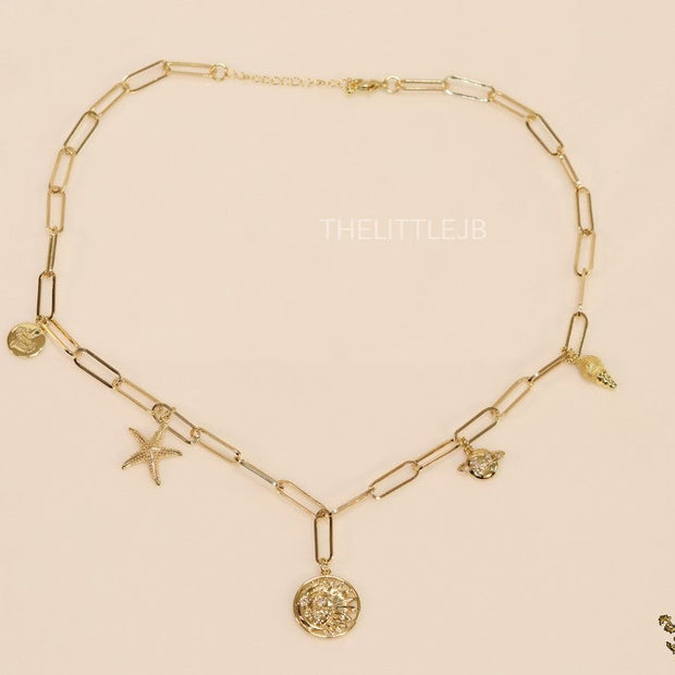 Gold plated link chain necklace with charms- snake, star fish, saturn, snail shell, Sun n Moon