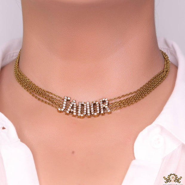 Golden multi chain choker necklace with alphabet motif in cz