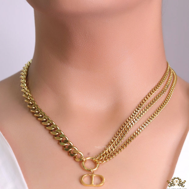 Multiple golden chain necklace with alphabet pendant