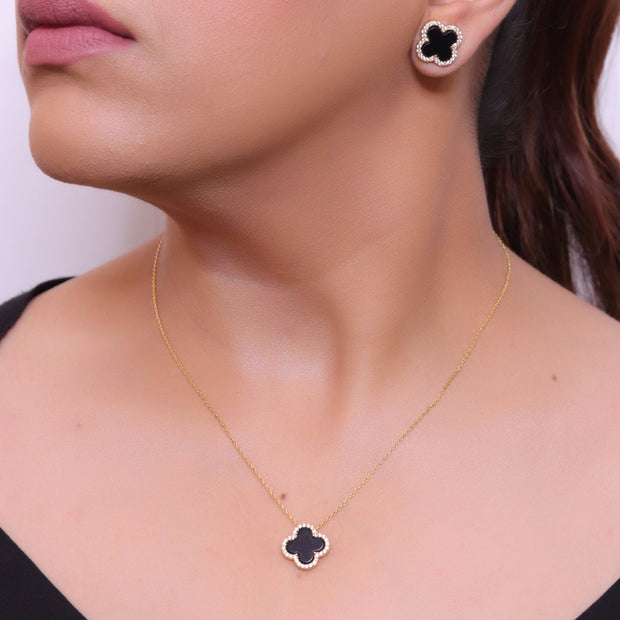 Sleek gold plated chain with cubic zirconia studded black clover shape pendant