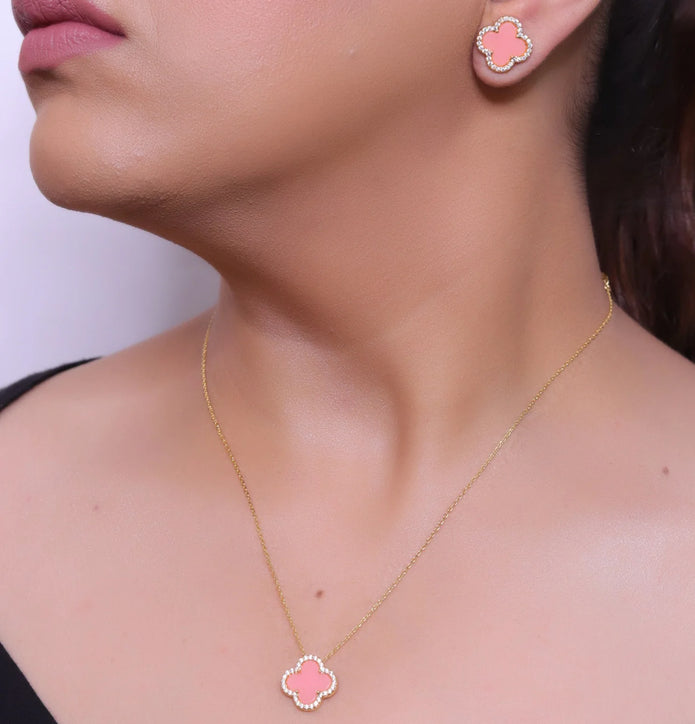 Sleek gold plated chain with cubic zirconia studded pink clover shape pendant