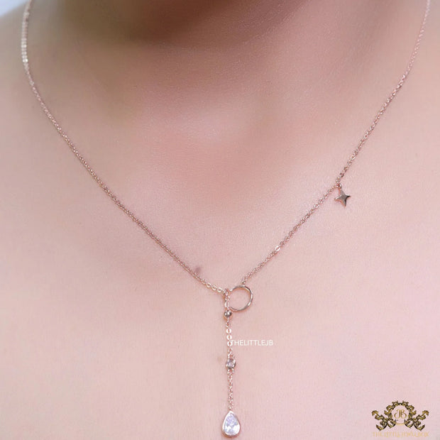 rose gold knot necklace with cz drop and small charms