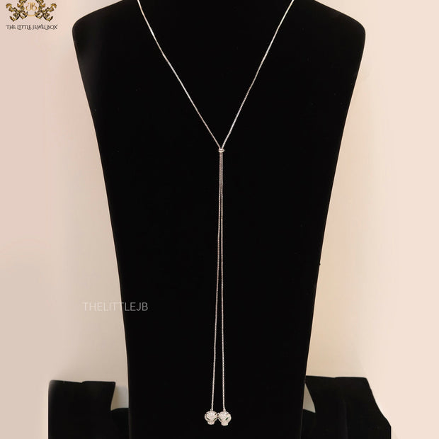Platinum plated knot necklace with twin cz panther pendants